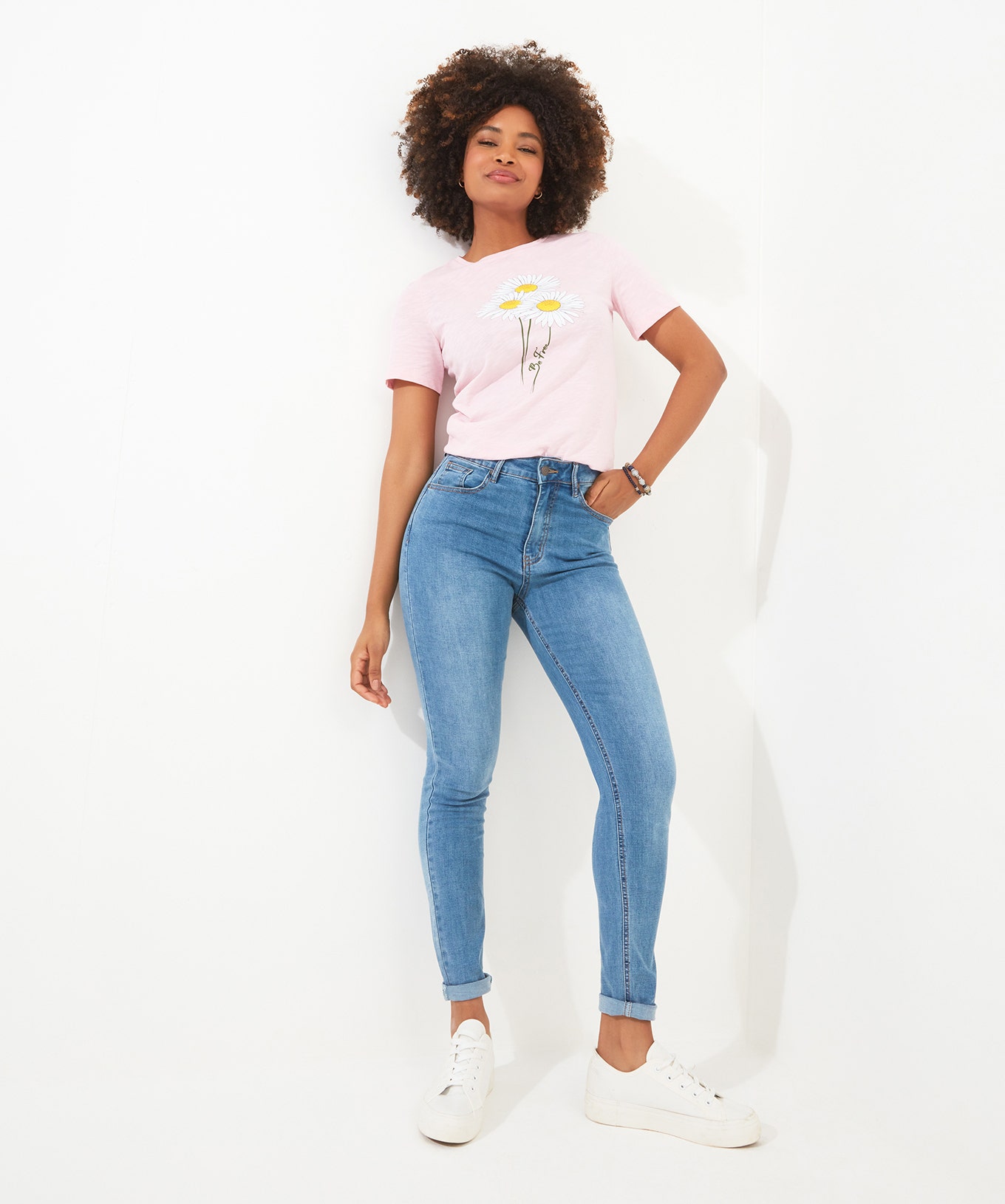 Women's White Pumps and Denim Trousers