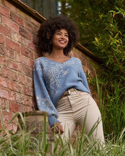 White High-Waisted Jeans and Blue Jumper